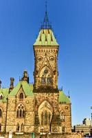 Parliament Hill and the Canadian House of Parliament in Ottawa, Canada during wintertime. photo