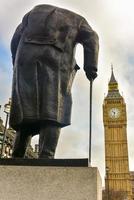 Statue of Sir Winston Churchill facing the Houses of Parliament in Parliament Square Garden in London, 2022 photo