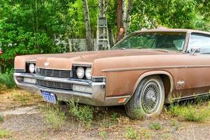 Rusting old car in a desert junk yard in Arizona, USA, 2022 photo