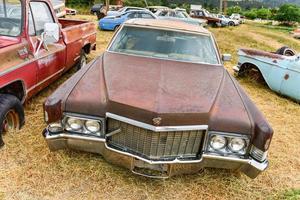 Rusting old car in a desert junk yard in Arizona, USA, 2022 photo