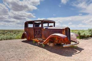 Route 66 vintage car relic displayed near the north entrance of Petrified Forest National Park in Arizona, USA, 2022 photo