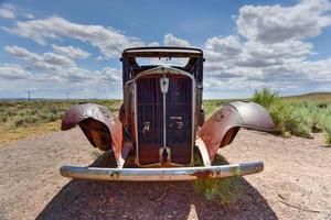 Route 66 vintage car relic displayed near the north entrance of Petrified Forest National Park in Arizona, USA, 2022 photo