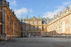 View of the famous palace of Versailles on an autumn day photo