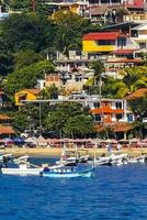 Puerto Escondido Oaxaca Mexico 2022 Fishing boats at the harbor beach in Puerto Escondido Mexico. photo