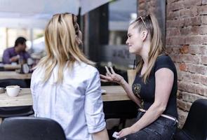 female friends enjoying at a party and laughing. photo