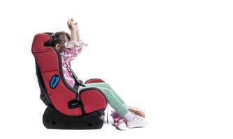 A little girl in a car seat photo