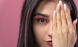 woman putting make up photo