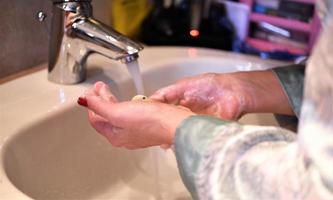 female washing hands photo
