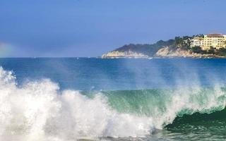 Extremely huge big surfer waves at beach Puerto Escondido Mexico. photo