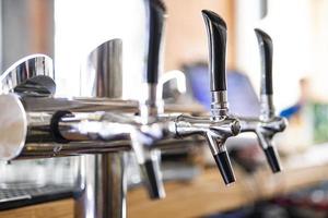 pouring a lager beer in a glass. photo