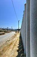 The Border Wall between the United States and Mexico from San Diego, California looking towards Tijuana, Mexico. photo