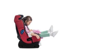 A little girl in a car seat photo