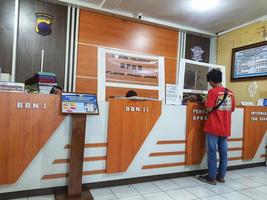 Central Java, Indonesia in October 2022. Several people are queuing and waiting at the BPKB service office or vehicle certificate of ownership at the Jepara Police photo