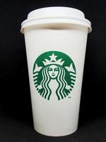 Semarang, Indonesia on July 2021. A Starbucks paper cup on a black background. photo
