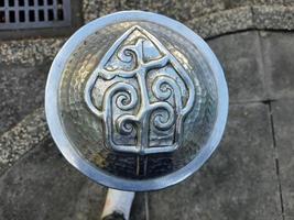 Pedestrian facilities on the Malioboro sidewalks include steel pipe bollards with traditional ornaments or motifs photo