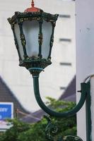 Typical Street Lamp in Malioboro with blue sky background and white cloud. photo