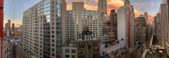 View of NYC skyscraper skyline in midtown Manhattan at sunset. photo