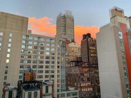 View of NYC skyscraper skyline in midtown Manhattan at sunset. photo