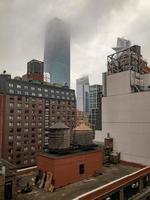 View of the roofs of Midtown Manhattan in New York City on a foggy day. photo