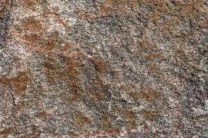 Close up view at a granite and stone wall texture in a hires photo