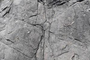 vista de cerca en una textura de pared de granito y piedra en alta resolución. foto