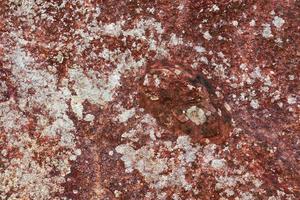 Close up view at a granite and stone wall texture in a high resolution. photo