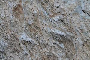 vista de cerca en una textura de pared de granito y piedra en alta resolución. foto