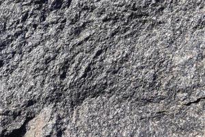 Close up view at a granite and stone wall texture in a hires photo