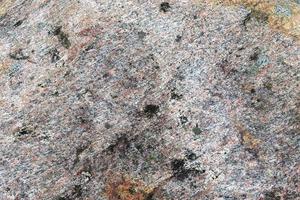 textura de pared de piedra de granito en una vista detallada de cerca en alta resolución. foto