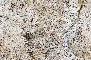 Close up view at a granite and stone wall texture in a hires photo