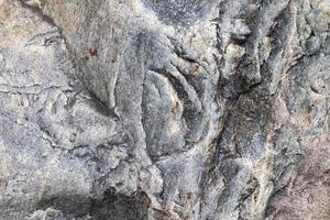 Granite stone wall texture in a detailed close up view in a high resolution. photo