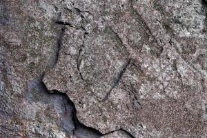 Detailed view on aged concrete walls with cracks and a lot of structure in high resolution photo