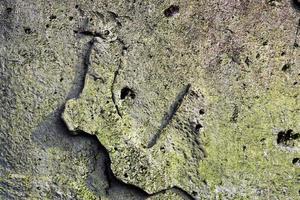 Detailed view on aged concrete walls with cracks and a lot of structure in high resolution photo