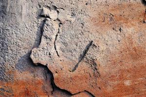 Detailed view on aged concrete walls with cracks and a lot of structure in high resolution photo