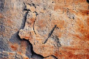 Detailed view on aged concrete walls with cracks and a lot of structure in high resolution photo