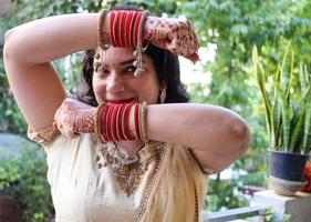 Beautiful woman dressed up as Indian tradition with henna mehndi design on her both hands to celebrate big festival of Karwa Chauth, Karwa Chauth celebrations by Indian woman for her husband photo