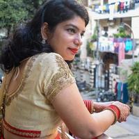 Beautiful woman dressed up as Indian tradition with henna mehndi design on her both hands to celebrate big festival of Karwa Chauth, Karwa Chauth celebrations by Indian woman for her husband photo