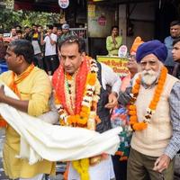 Delhi, India, December 02 2022  - Bharatiya Janata Party BJP supporter during mega road show in support of BJP candidate Pankaj Luthara to file nomination papers ahead of MCD local body Elections 2022 photo