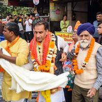 Delhi, India, December 02 2022  - Bharatiya Janata Party BJP supporter during mega road show in support of BJP candidate Pankaj Luthara to file nomination papers ahead of MCD local body Elections 2022 photo