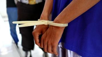 Man handcuffed hands. Prisoner or arrested. photo