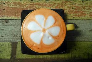 Travel to Ayutthaya, Thailand. The colorful thai tea cup on the wooden background. photo