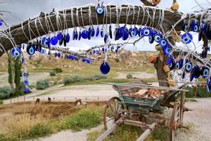 Travel to Goreme, Turkey. The turkish traditional souvenirs 'Cat's eyes' on the tree. photo