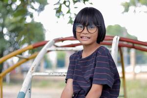 Portrait of child wearing eyeglasses with blur background. photo