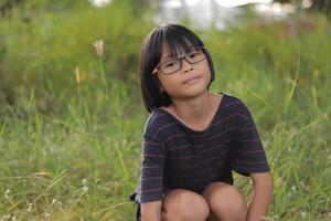 Portrait of child wearing eyeglasses with blur background. photo