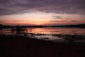 Beautiful nature view at sunset, red-orange sky view and river at sunset. photo