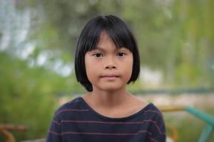 Portrait of little girl with blurred background photo