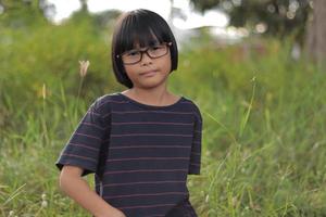 Portrait of child wearing eyeglasses photo