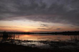 Beautiful nature view at sunset, red-orange sky view and river at sunset. photo