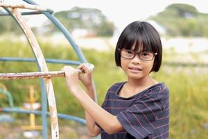 Portrait of child wearing eyeglasses with blur background photo