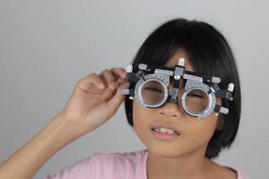 Child eye test, test eye concept, girl eye test photo